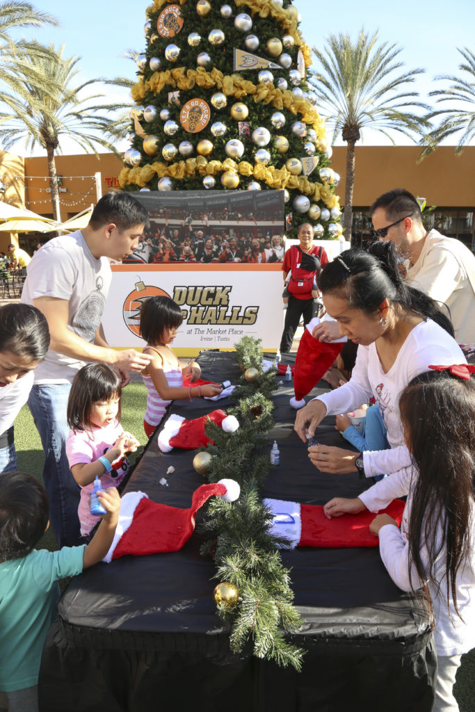 Families decorate stockings during DUCK the Halls Family Events 2015 at The Market Place.