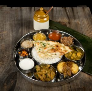 Try the Veggie Thali with Naan at Southern Spice Indian Kitchen at Crossroads in Irvine.
