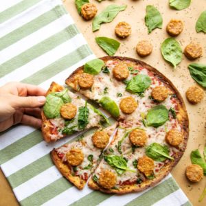 Vegan Spicy Italian Sausage Rounds on Pizza at Pieology